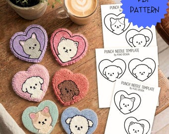 May include: A collection of six heart-shaped punch needle patches featuring various cat and dog faces in pastel colours, alongside three white paper sheets labelled PUNCH NEEDLE TEMPLATE by POKO DESIGN with black line art illustrations of the animals.