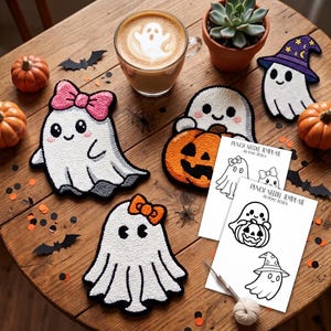 May include: Three white ghost punch needle projects with accessories including a pink bow, an orange bow, and a purple wizard hat. Two white paper punch needle templates by Poko Design are included, along with a metal punch needle tool and yarn.