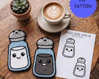 May include: Two punch needle coasters shaped like salt and pepper shakers with light blue borders and smiling faces, alongside a white paper sheet labeled PUNCH NEEDLE TEMPLATE BY POKO DESIGN featuring black line drawings of the same shakers.