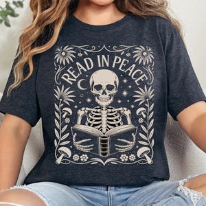 Read in Peace Skeleton Book T-Shirt: Spooky Halloween Reading Tee