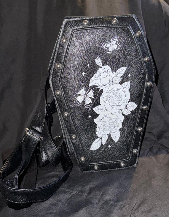 coffin mini backpack The Nightmare Before Christmas ITA The Nightmare Before Christmas movie fan merchandise is a black coffin ITA mini backpack made of PU material and includes adjustable straps for the perfect fit Casket Of Sorrow Mini Backpack