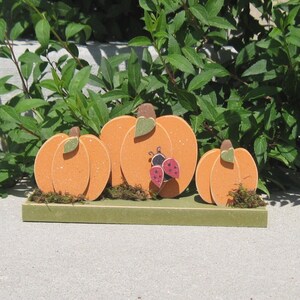 TRIPLE PUMPKINS on a base with a ladybug for home decor, porch, Autumn and Fall decor image 1