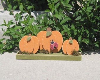 TRIPLE PUMPKINS on a base with a ladybug for home decor, porch, Autumn and Fall decor