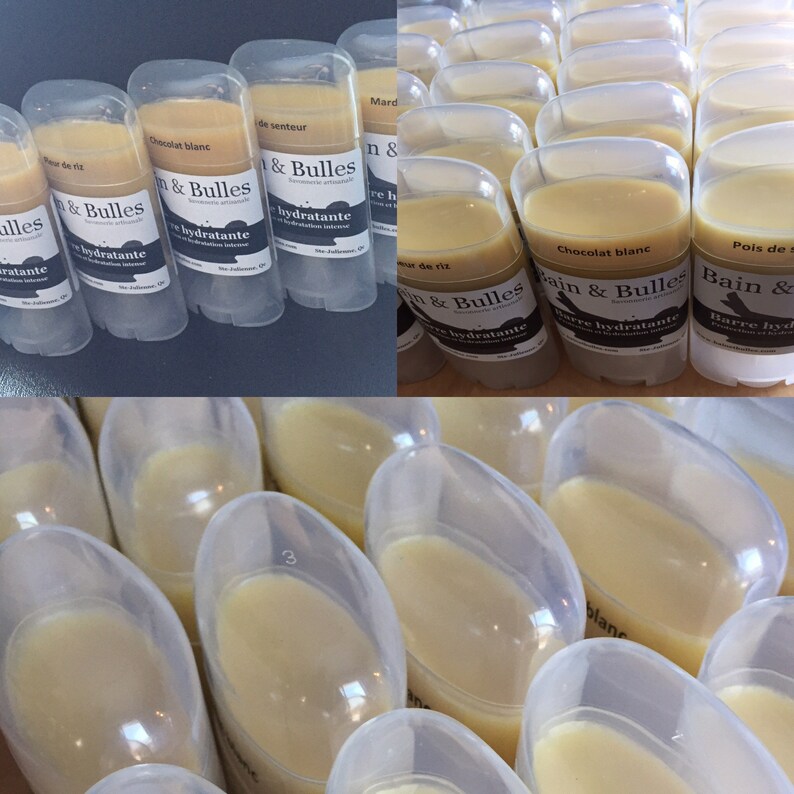 May include: A close-up of several clear plastic tubes filled with a light yellow substance. The tubes are labeled with the text "Bain & Bulles" and "Barre hydratante".
