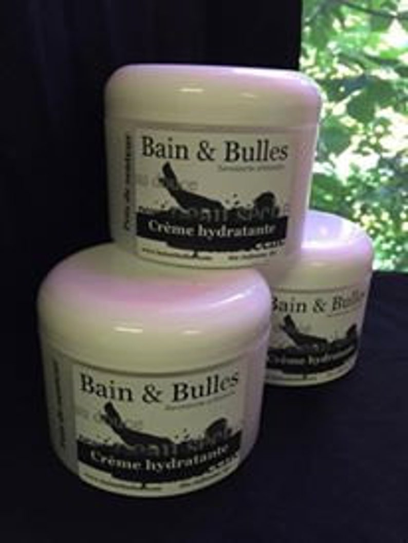 May include: Three white jars of Bain & Bulles moisturizing cream. Each jar has a black label with the company name and logo, and the words "Cr&egrave;me hydratante".
