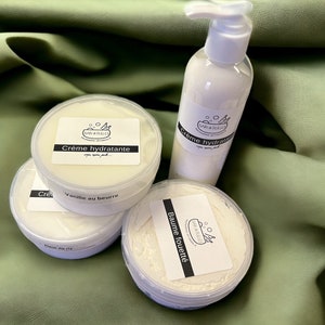 May include: Four white jars of body cream with black labels. The labels have the text "DAN & BULLES" and the names of the creams: "Cr&egrave;me hydratante", "Vanille au beurre", and "Baume fouett&eacute;".