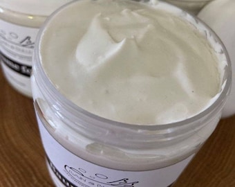 May include: A white jar of creme fouette, a whipped body butter, with a black and white label that reads "Bain & Bulles, Epicerie Artisanale, Creme Fouette".