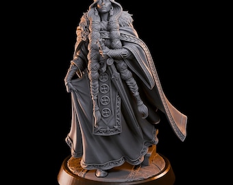 May include: A gray 3D printed figurine of a woman wearing a crown, a long robe, and a cloak. She is holding a sword in her right hand and has long braids.