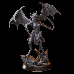 May include: A grey, detailed figurine of a female demon with wings, horns, and a whip. She is standing on a rocky base with a small plant.