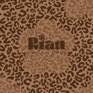 May include: A brown leopard print pattern with a lighter brown overlay. The text "Rian graphic house" is centered in a dark brown font. The design features a repeating pattern of leopard spots.