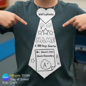 May include: A white paper tie-shaped craft with the text "kid's photo" at the top, and the words "NAME", "Is 100 Days Smarter", and "Mrs. Johnson's Class Lincoln Elementary" printed on it. The tie is hanging around a person's neck.