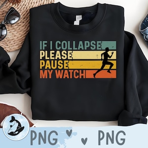 May include: Black sweatshirt with the text "IF I COLLAPSE PLEASE PAUSE MY WATCH" in white, yellow, and orange. A silhouette of a runner is on the right side of the text. The sweatshirt is a casual athletic wear item.