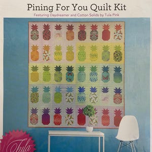 May include: A quilt kit featuring a colorful pineapple pattern with butterflies and birds. The kit includes fabric for a 72" x 77 1/2" quilt, designed by Tula Pink.