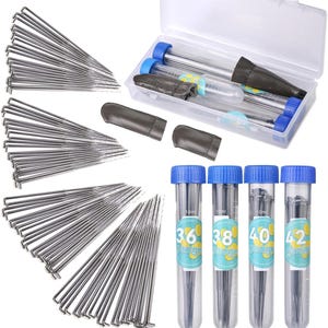 May include: Set of 100 knitting needles in four different gauges: 36, 38, 40, and 42. The needles are stored in clear plastic tubes with blue caps and labels. The needles are arranged in a fan shape and come with a storage case.