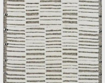 May include: A rectangular rug with a geometric pattern. The rug features alternating horizontal stripes of white and gray, creating a textured appearance. The edges are bordered with a gray trim and tassels. This rug is suitable for home decor.