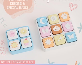 May include: A digital download set featuring 11 new keycap designs and special bases, labeled Build Your Own Keycap Pack 02. The image displays square keycaps in pastel colors with icons including a moon, flower, paw print, bow, dumpling, cupcake, sun, sparkles, and butterfly.