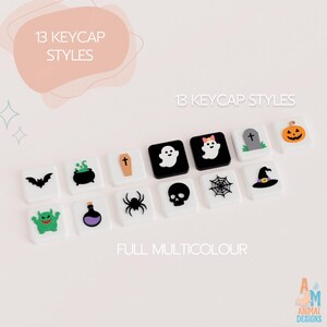 May include: Thirteen square mechanical keyboard keycaps featuring Halloween-themed icons including a bat, cauldron, coffin, ghosts, tombstone, pumpkin, monster, potion bottle, spider, skull, spiderweb, and witch hat in black, white, and colors.