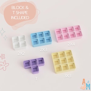 May include: A collection of five silicone molds in white, blue, pink, purple, and yellow. The molds feature square cavities in 2x2, 2x3, 2x4, 3x3, and T-shaped configurations. Text on the image reads BLOCK & T SHAPE INCLUDED, 2X2, 2X3, 2X4, T, 3X3.