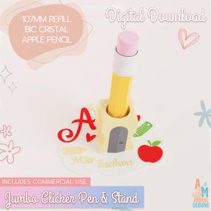 May include: A yellow pencil with a pink eraser standing in a light yellow pencil sharpener-shaped stand. The stand features a gray blade detail and sits on a white base decorated with a red letter A, a red apple, and the text Miss Jackson.