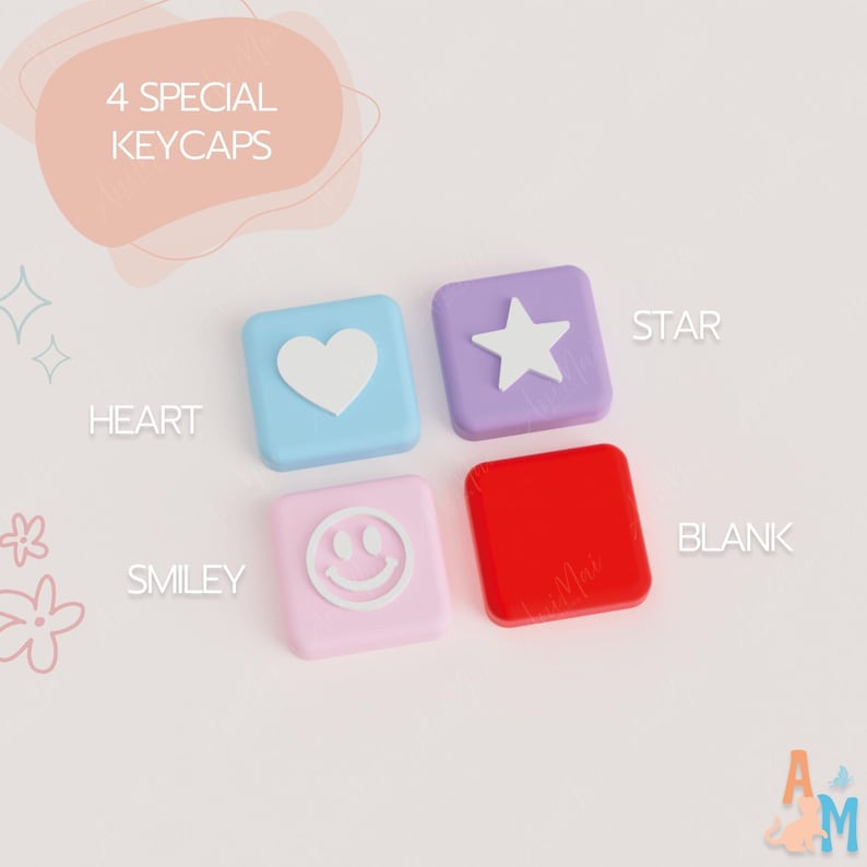 May include: Four square keycaps labeled 4 SPECIAL KEYCAPS. One light blue with a white heart, one purple with a white star, one light pink with a white smiley face, and one solid red blank keycap. Each is labeled with its respective design name.