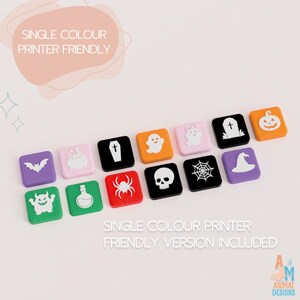 May include: A collection of fourteen square tiles featuring white Halloween-themed icons including a bat, cauldron, coffin, ghost, cat, tombstone, pumpkin, monster, potion bottle, spider, skull, spiderweb, and witch hat in various colors.