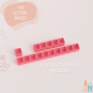 May include: A collection of pink square letter bases arranged in two rows, with one single base separated to the left. The text 1-10 LETTER BASES and UP TO 10 LETTER BASES INCLUDED is visible on the image, indicating the quantity of items.