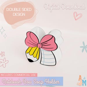 May include: A white notebook bow soap holder with a pink bow and a yellow pencil design. The text "DOUBLE SIDED DESIGN" and "INCLUDES COMMERCIAL USE" are visible. The words "Digital Download" and "Notebook Bow Soap Holder" are also present.