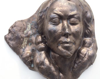 Wall hanging face sculpture, stoneware art mask, portrait of a woman with bronze glaze