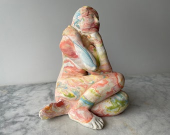 Ceramic figure sculpture seated nude  figurine fluid painting marbled porcelain slip on stoneware clay body mature