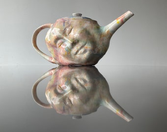 Colorful face teapot sculpture pottery head vessel, marbled slip drips bust portrait dreamer surreal fluid painting ceramic art