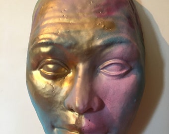 Wall hanging face sculpture larger than life sized portrait mask of a man, multicolored spray painted ceramic stoneware colossus