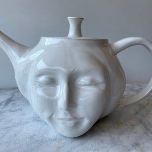 Face Teapot Serving Sculpture, Ceramic Head Dreaming in Bliss, Surreal Kitchen Art Pottery Vessel Glazed White with Rainbow Drip