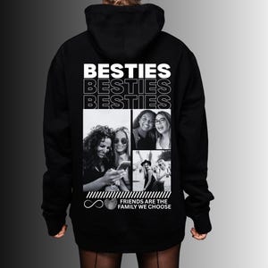 May include: Black hoodie with the word "BESTIES" in white block letters. Below the text is a collage of black and white photos of friends. The phrase "FRIENDS ARE THE FAMILY WE CHOOSE" is printed at the bottom.