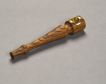 May include: A wooden pipe with a brass bowl and a dark wood grain pattern.