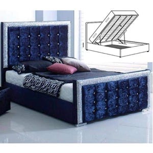May include: A blue velvet upholstered bed frame with a tufted headboard and a diamond-shaped crystal trim. The bed frame has a lift-up storage compartment.