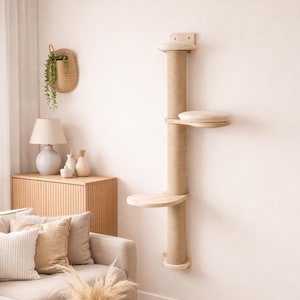 May include: A wall-mounted cat tree with a natural wood finish. It features a sisal-wrapped scratching post, two circular platforms, and a cushioned perch. The cat tree is designed to provide a space for cats to play and relax.