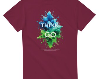 May include: A maroon t-shirt featuring a graphic of blue and green paint splatters. The text "Think Go" is written in white on the graphic. The text "One planet two colours, blue & green" is written in white below the graphic.