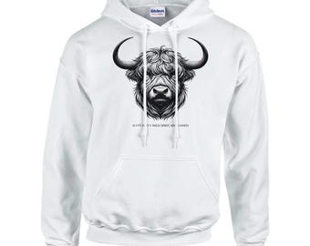 May include: White hooded sweatshirt with a black and white illustration of a Highland cow's head. The text "Scotland's Wild Spirit Un-Tamed" is printed below the image.