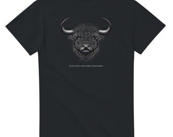 May include: Black t-shirt with a white graphic of a Highland cow's head. The text "Scotland's Wild Spirit, Unleashed" is printed below the image.