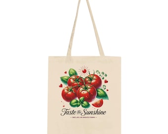 May include: A beige tote bag with a red, green, and white illustration of tomatoes and basil. The text "Taste the Sunshine - Sweet, Juicy, and Absolutely Stunning -" is printed on the bag.
