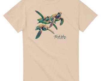 May include: A beige t-shirt with a graphic of three sea turtles swimming. The text "Think blue, go green!" is printed below the turtles.