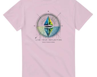 May include: Pink t-shirt with a compass design and the text "Live Your Reflection, Break Through Norms".