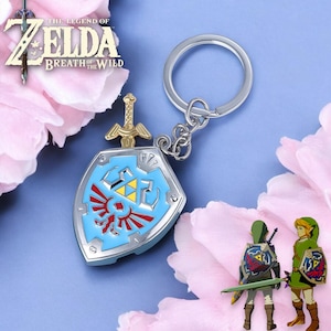 Metalen hangers met schild en meesterzwaard van Hylian | Zelda-sleutelhangers Breath Of The Wild | Gamersieraden | Unieke rugzakaccessoires x cadeau-ideeën
