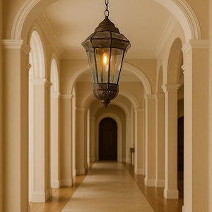Handcrafted Mexican lantern, 23 inches tall, with beveled glass and brass details—perfect for luxury interiors or boutique hotels.