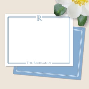 May include: Blue and white stationery with a simple border and the text "THE RICHLANDS" and the letter "R" in the top center.