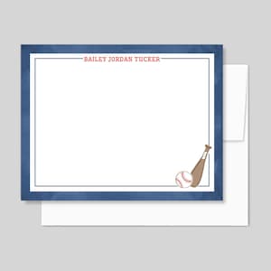 May include: Stationery set featuring a baseball theme. The design includes a white notepad with a blue border and the name "BAILEY JORDAN TUCKER" in red. A baseball and bat graphic is in the corner. Includes a white envelope.