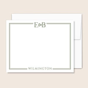 May include: White stationery set with a green border and text. The top of the card reads "E&B" and the bottom reads "WILMINGTON". Includes a white envelope. The stationery is blank and ready for personalization.