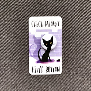May include: A white button with a black cat illustration and the text "Check Meow't Kitty Button" on a purple background.
