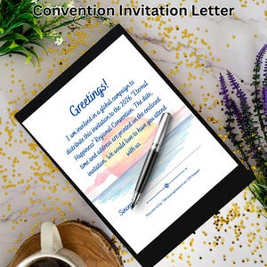 May include: A black framed invitation letter for the 2026 "Eternal Happiness" Regional Convention. The letter includes the text "Greetings!" and a message about the event. A pen rests on the invitation, with a cup of coffee and flowers in the background.