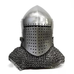 May include: A silver-colored medieval helmet with a rounded top and a faceplate covered in small holes. The helmet includes a chainmail neck guard. The design is reminiscent of historical armor.